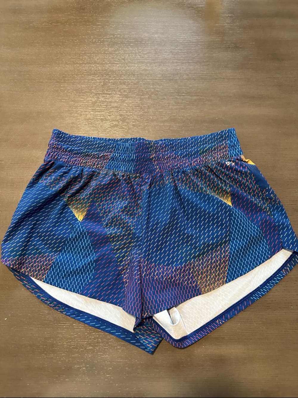 DSG running shorts, size large, blue/multicolor